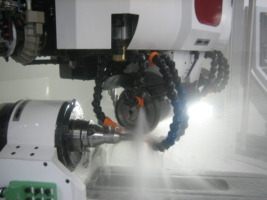 close up action view of spraying coolant for the coolant comat super filtration equipment