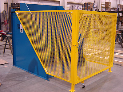Endura-Veyor 2000 lb container dumpster with gated enclosure in yellow and blue