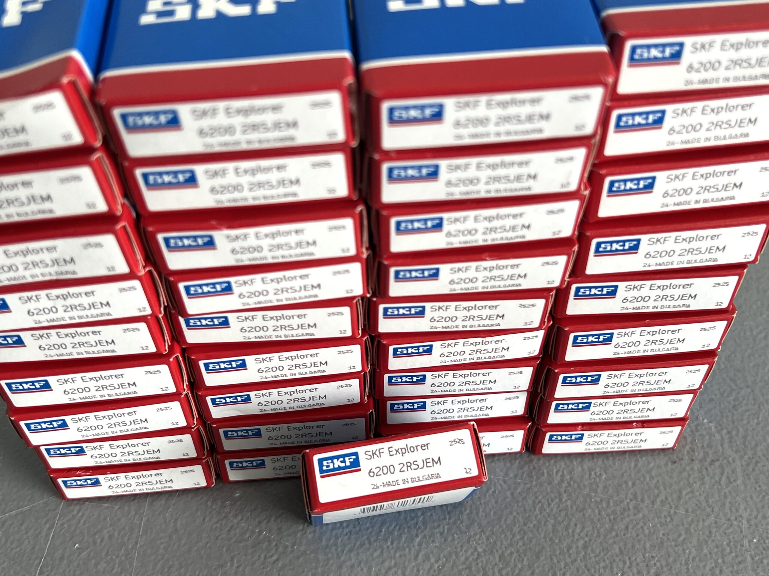 Four stacks of red and blue SKF Explorer Bearing boxes